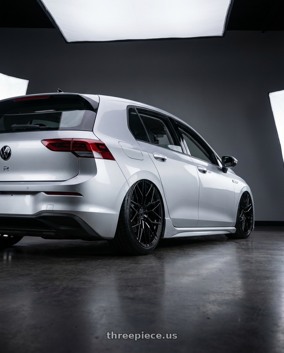 2024 Volkswagen Golf R MK8 with Avant Garde Wheels M520R 5X112 19x9.5 +40 Gloss Black wheels rear three quarter view slight stretch tires