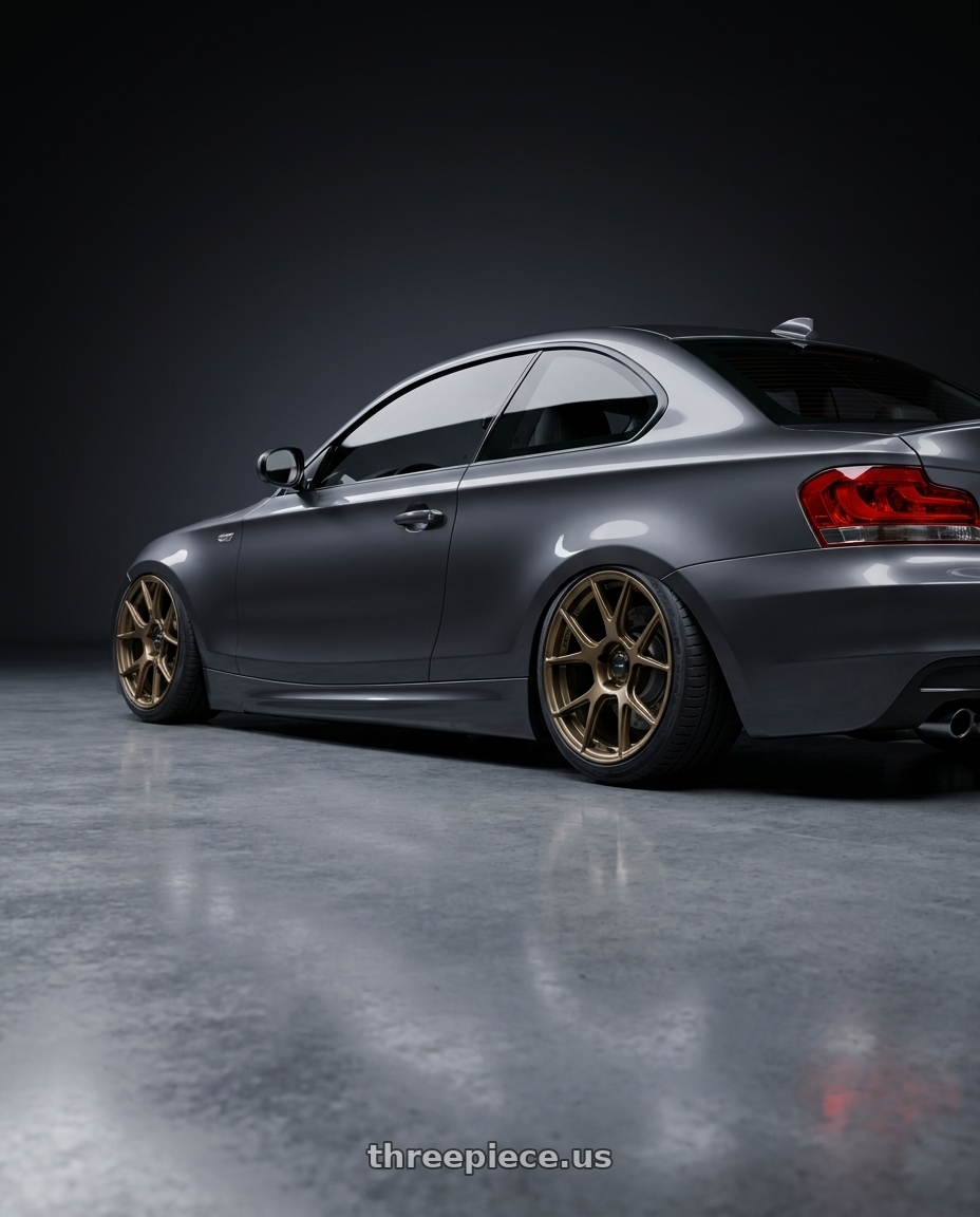 2012 BMW 1 Series E82 with Konig Ampliform 5x120 19x8.5+32 Gloss Bronze wheels rear three quarter view slight stretch tires