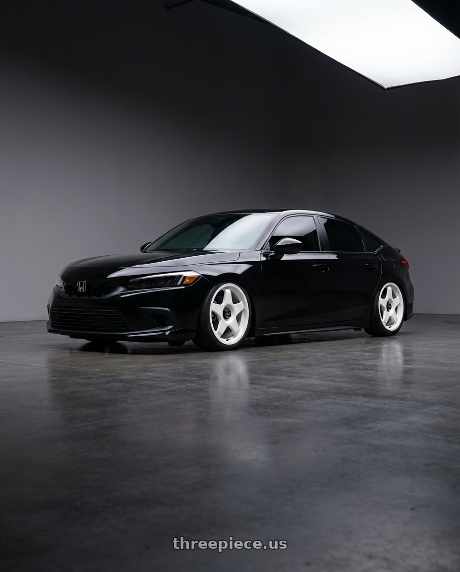 2023 Honda Civic Hatchback front lip  with fifteen52 CHICANE 5x114.3 / 5x100 18x8.5 +35 RALLY WHITE (GLOSS WHITE) wheels front three quarter view slammed stance