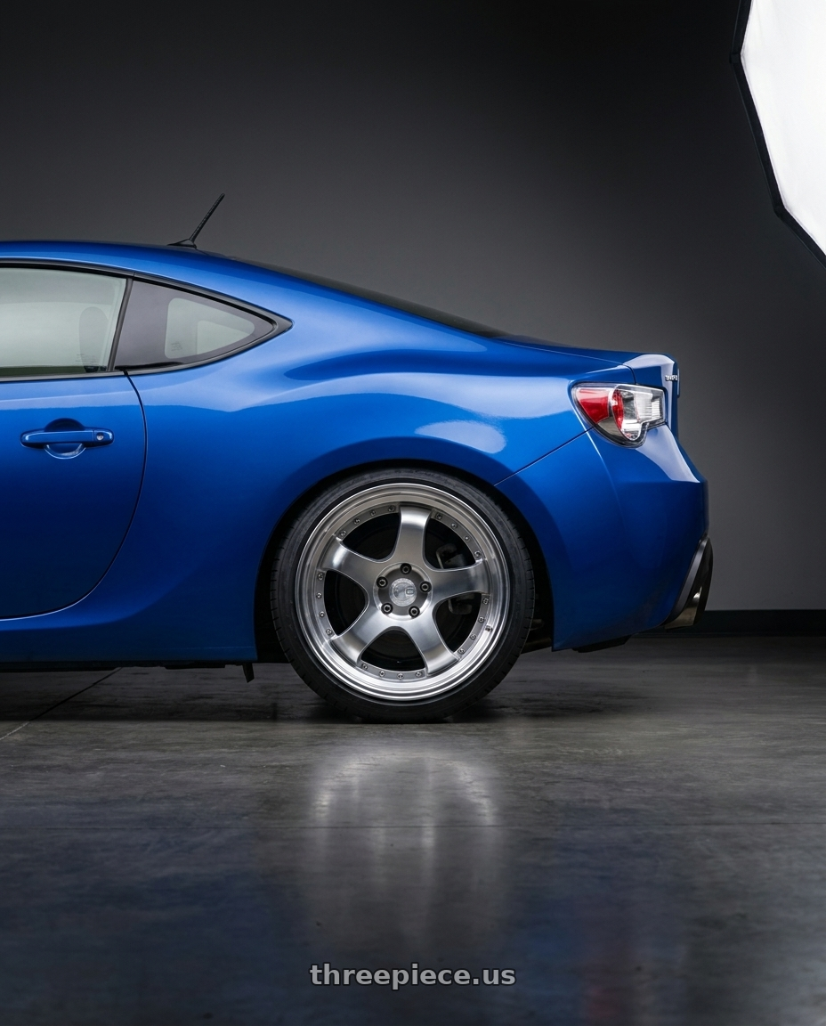 2013 Subaru BRZ with Aodhan AH03 5x100 18x9.5+35 Silver w/Machined Face wheels rear three quarter view square tires