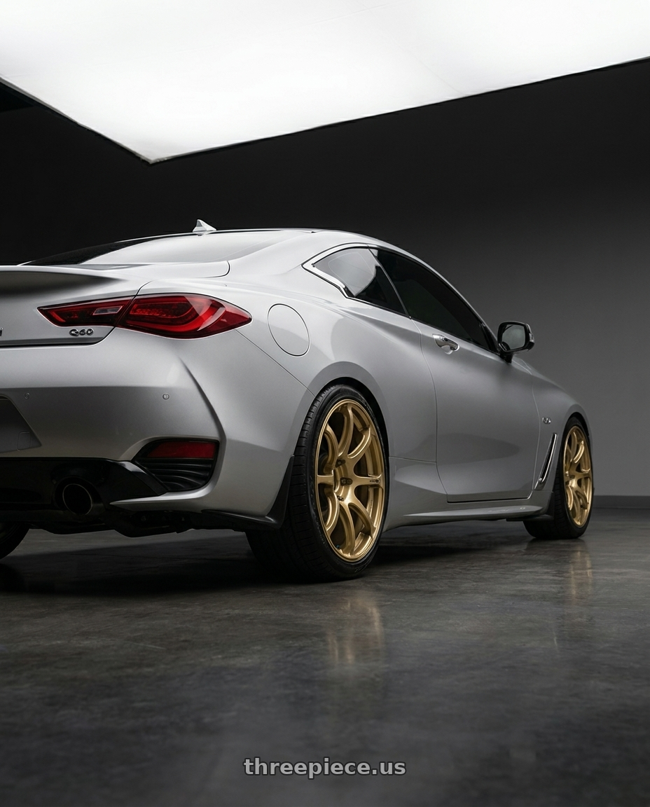 2020 Infiniti Q60 with Advan RGIII 5x114.3 19x9.0+25 Gold wheels rear three quarter view square tires