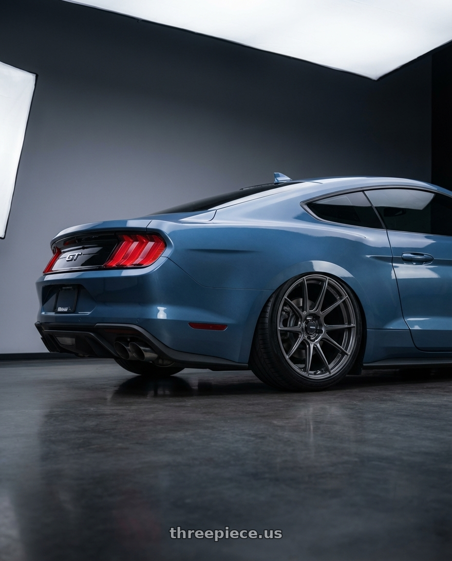 2022 Ford Mustang GT with Konig Ampliform 5x114.3 20x11+50 Dark Metallic Graphite wheels rear three quarter view slight stretch tires