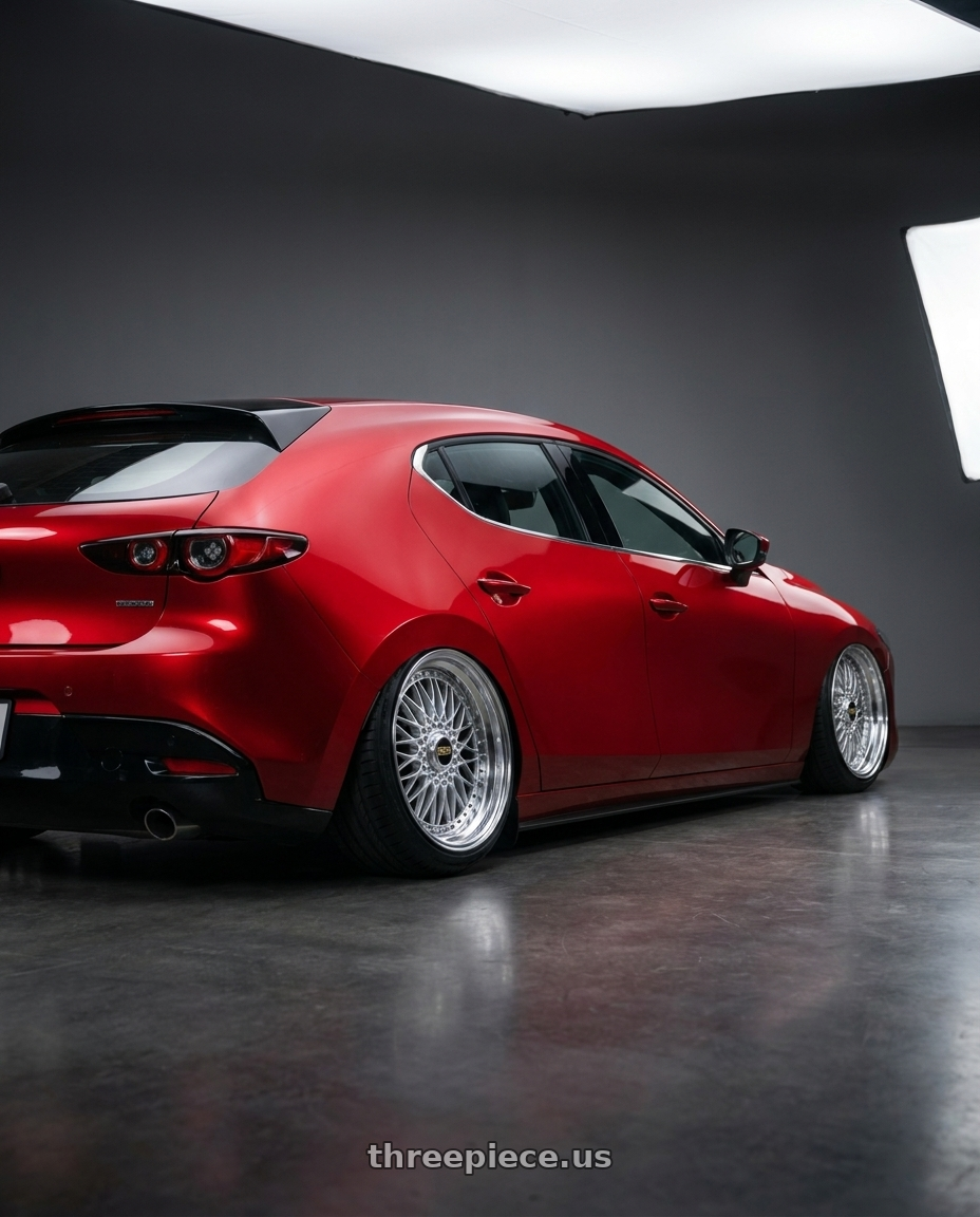 2024 Mazda 3 with BBS Super 5x112 19x9 +28 Diamond Silver wheels rear three quarter view extreme stretch tires