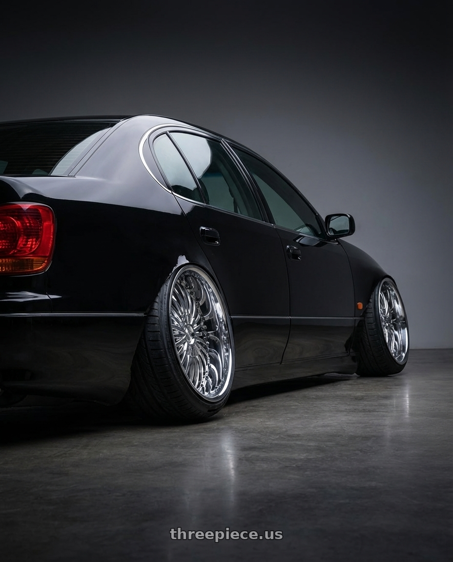 1999 lexus gs300 with Strada Spina 5x114.3/5x127 22x8.5 +40 Chrome wheels rear three quarter view extreme stretch tires