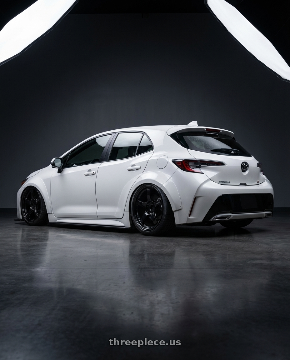 2023 Toyota Corolla Hatchback with Gram Lights 57CR 5x114.3 18x9.5+22 Glossy Black wheels rear three quarter view slight stretch tires