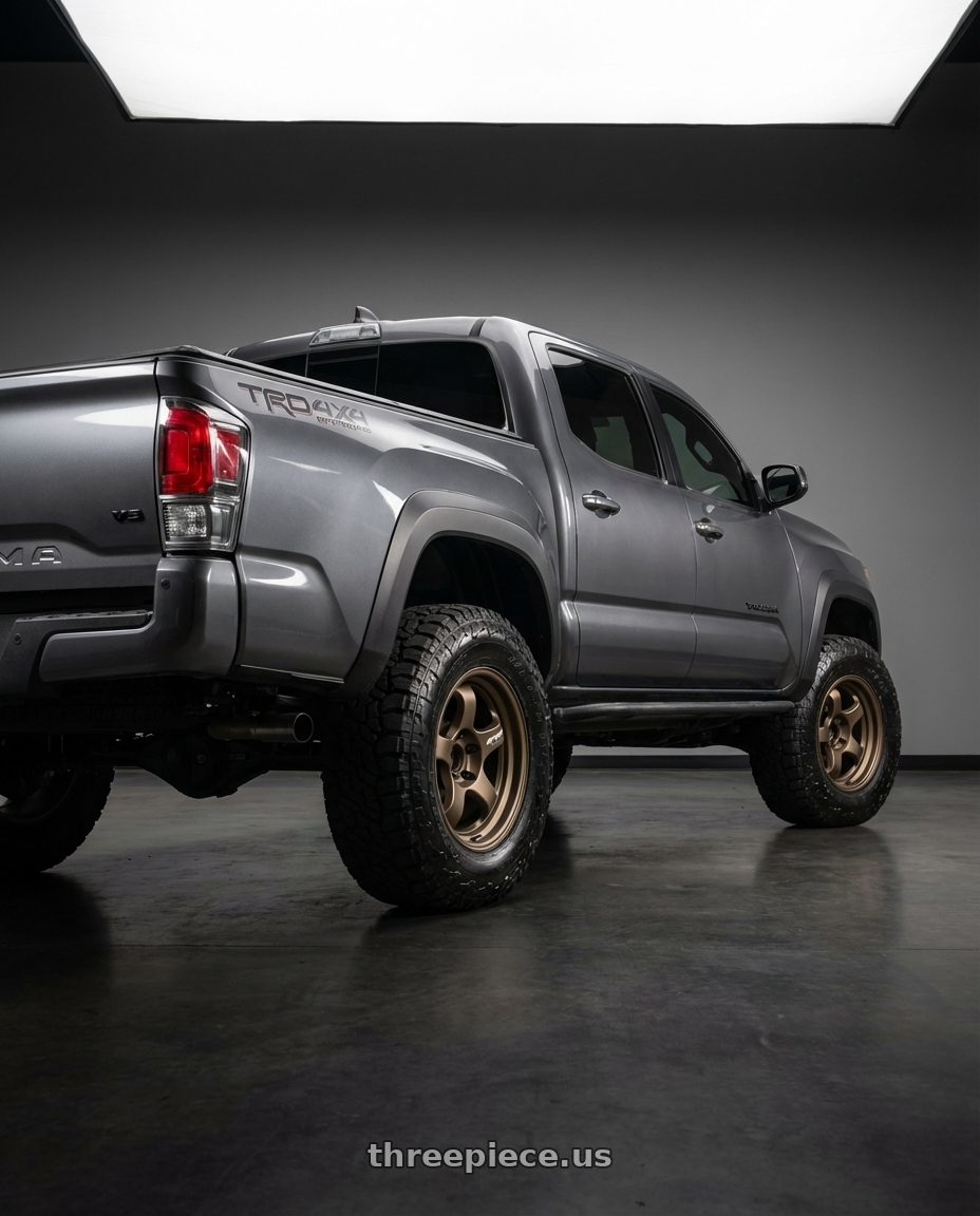 2021 Toyota Tacoma with WORK Meister S1 SUV 6x139.7 18x9+18 Matte Bronze wheels rear three quarter view meaty tires