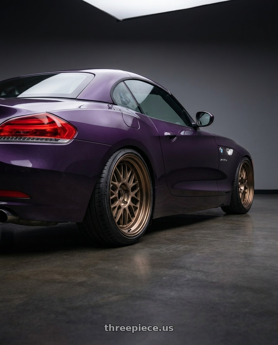 2011 bmw z4 with Volk Racing 21A 5x120 18x9.5 +22 BRONZE wheels rear three quarter view slight stretch tires