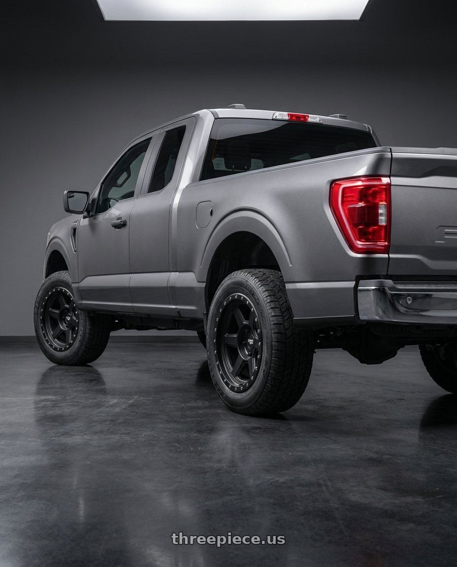 2021 Ford F-150 XL with Dirty Life Compound 9315 6x135 18x9-12 Matte Black wheels rear three quarter view square tires