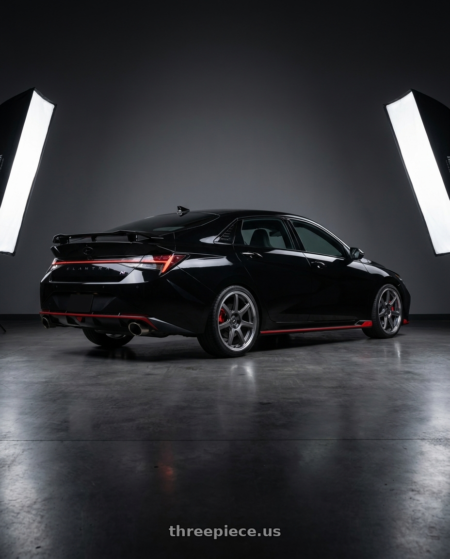 2023 Hyundai Elantra N with Work T7r 2P 5x114.3 19x8.0 +45 Matte Gunmetal wheels rear three quarter view square tires