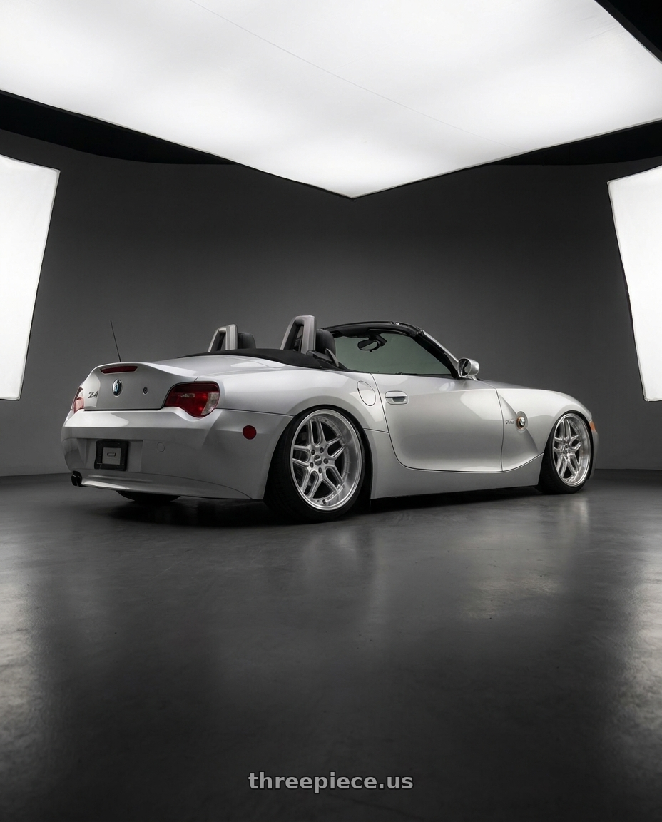 2006 BMW Z4 with ESR Wheels CS SERIES CS15 5x120 18x9.5 +35 Hyper Silver wheels rear three quarter view slight stretch tires
