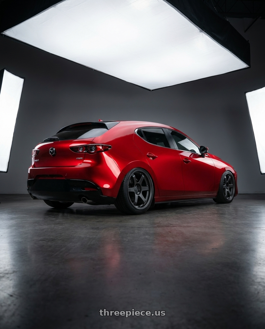 2024 Mazda 3 with 9six9 SIX-1 5x114.3 19X8.5 +35 Carbon Gray wheels rear three quarter view slight stretch tires
