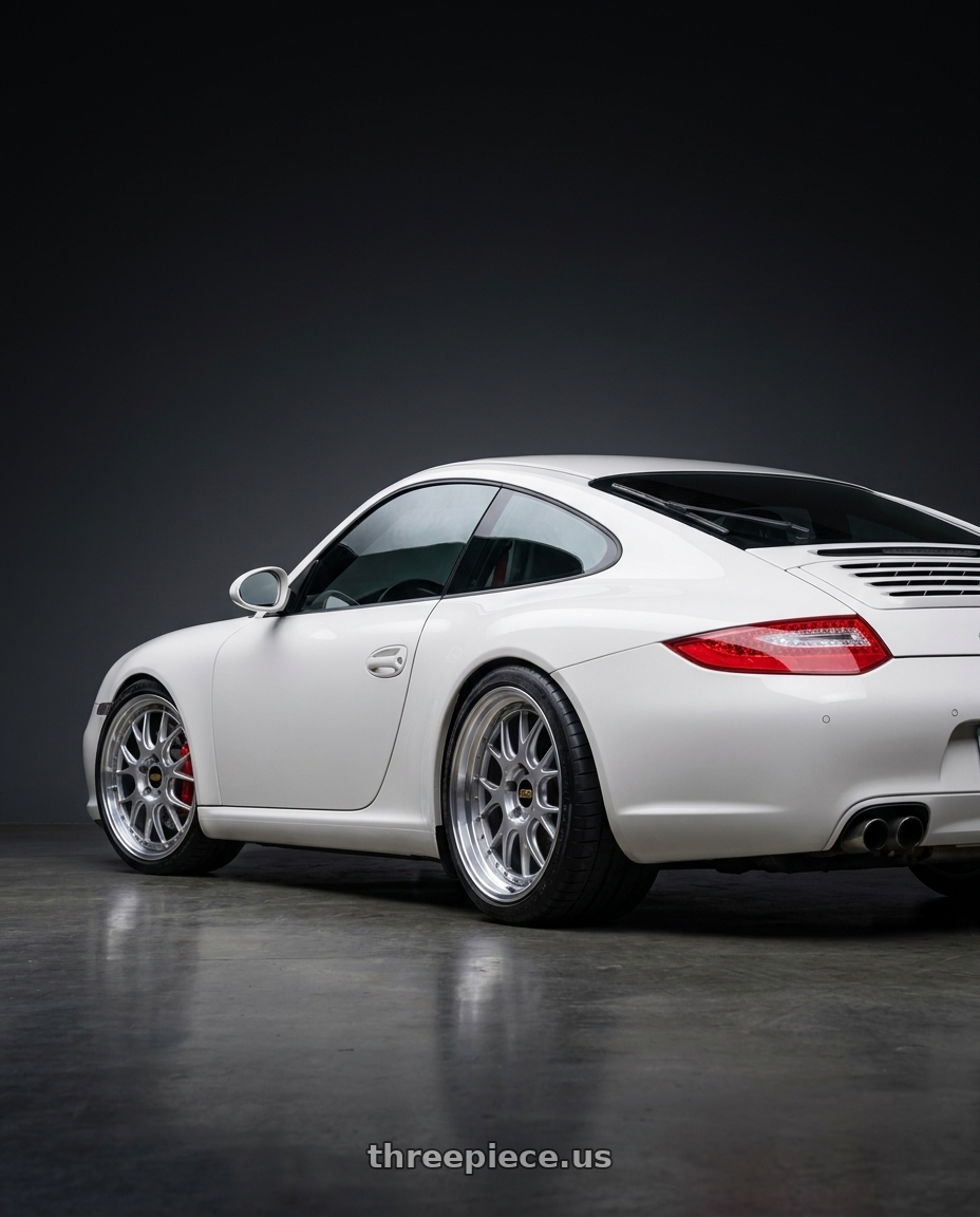 2009 Porsche 997.2 Carrera with BBS LM-R 5x130 19x11.0+63 Diamond Silver wheels rear three quarter view square tires