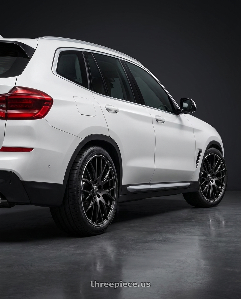 2019 BMW X3 G01 with Homura 2X9G 5x150 22x10+55 Black Mica / Rim Edge DMC wheels rear three quarter view square tires