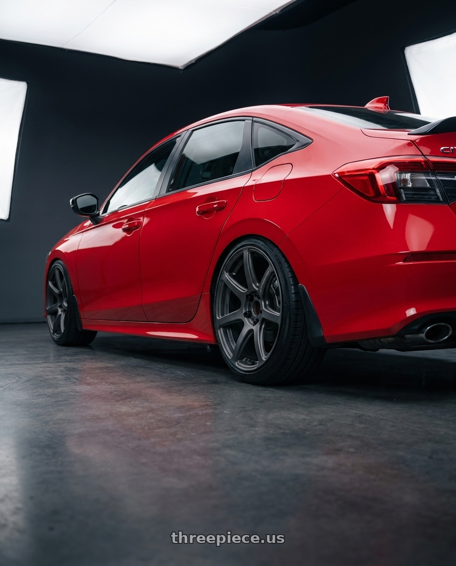 2026 civic si  with Work Emotion T7r 5x100 18x9.5 +38 Matte Gunmetal wheels rear three quarter view slight stretch tires