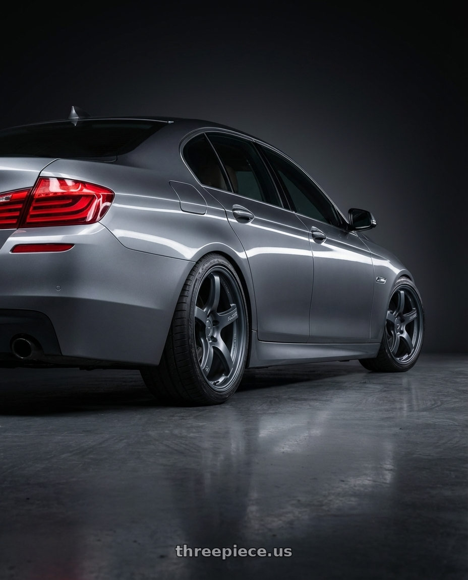 2016 BMW 5 Series F10 with Gram Lights 57CR 5x120 19x9.5+35 Gunblue II wheels rear three quarter view square tires