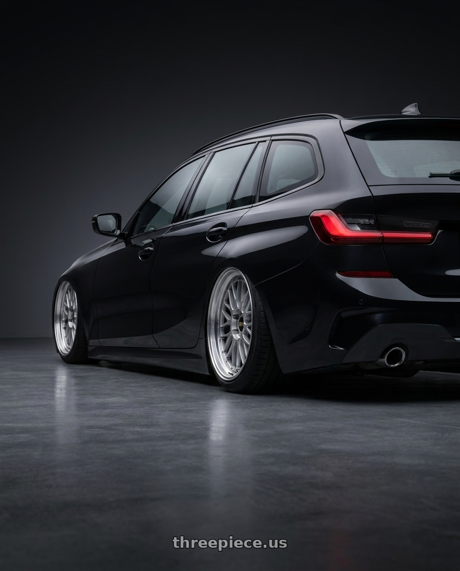 2020 bmw G21 with BBS LM 5x114.3 18x10.0+20 Diamond Silver wheels rear three quarter view slight stretch tires
