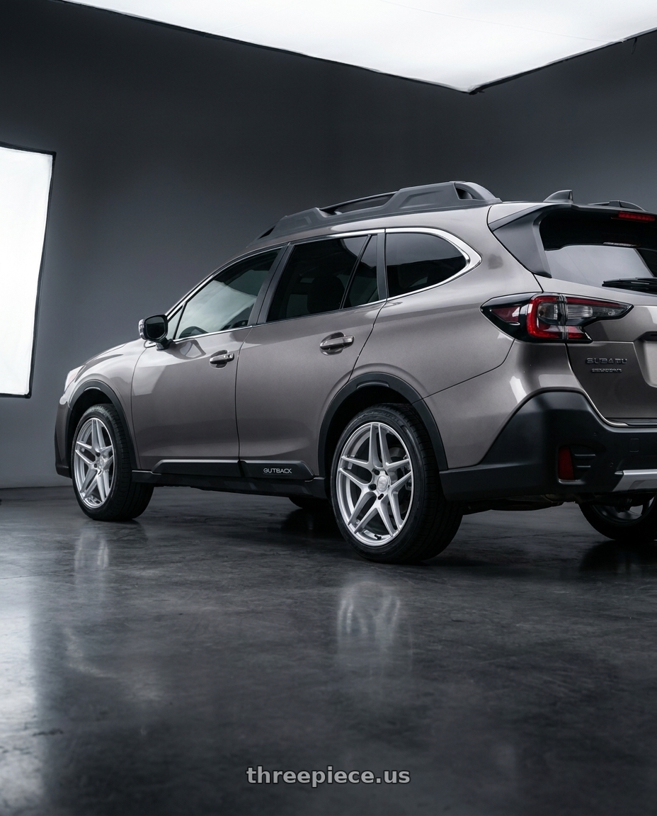 2024 Subaru Outback with Kansei K15H Astro 5X100 18x9 22 Hyper Silver wheels rear three quarter view square tires