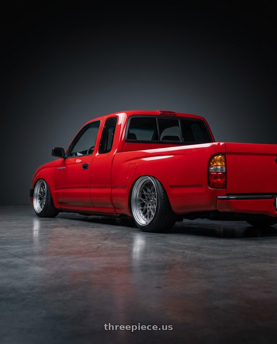1996 toyota tacoma with ESR Wheels CS SERIES CS3 5x114.3 18x10.5 +22 Matte Graphite wheels rear three quarter view extreme stretch tires