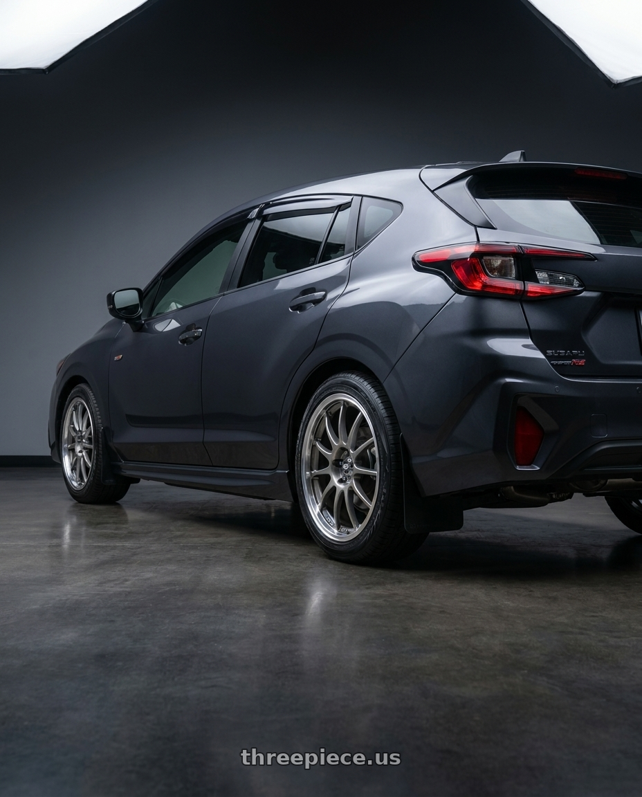 2024 Subaru Impreza RS with Enkei J10 4x100/114.3 15x6.5+38 Silver w/ Machined Lip Dia wheels rear three quarter view square tires