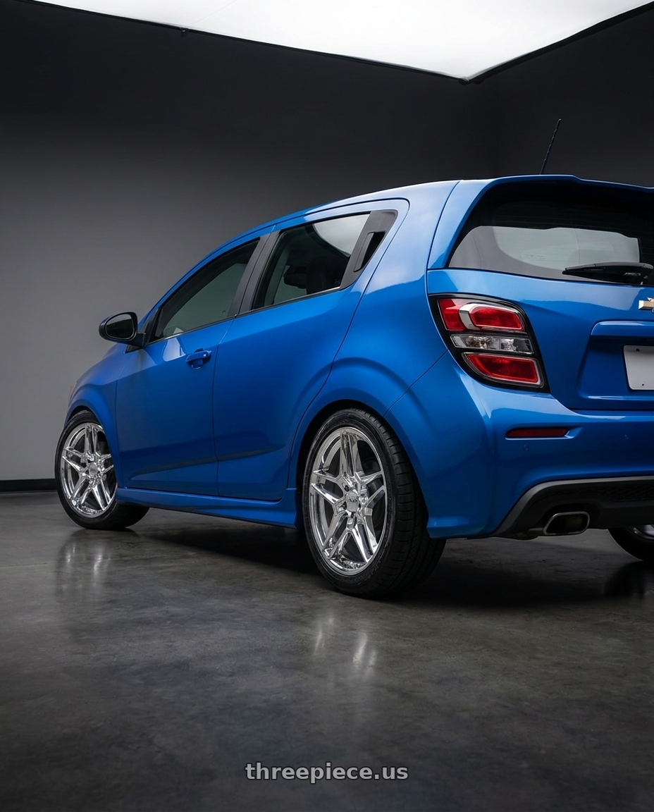 2020 Chevrolet Sonic RS Blue with Helo HE919 5X105 17X7.5 +38 CHROME wheels rear three quarter view square tires