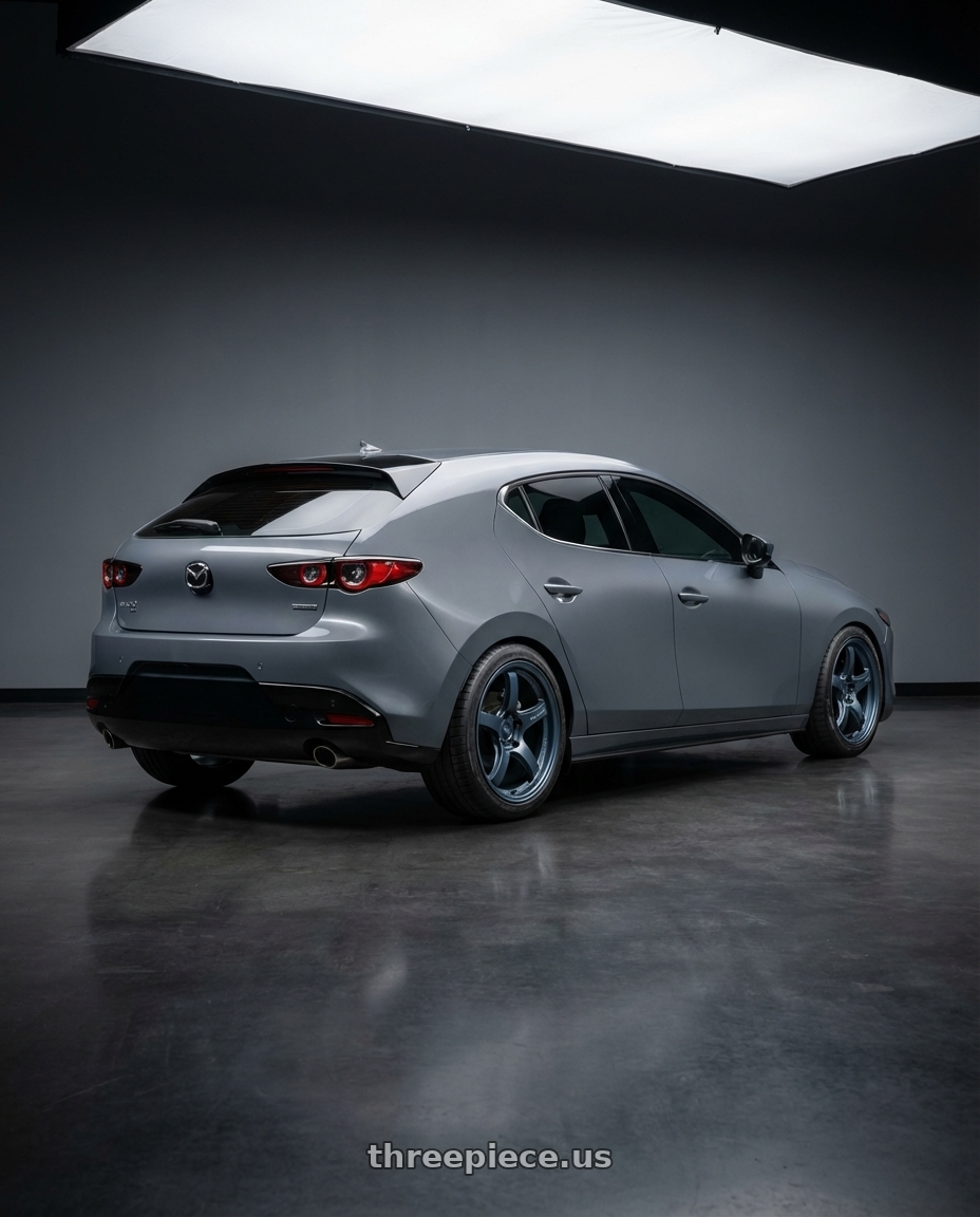 2023 Mazda Mazda3 Turbo with Gram Lights 57CR 5x114.3 18x10.5+12 Gunblue II wheels rear three quarter view square tires