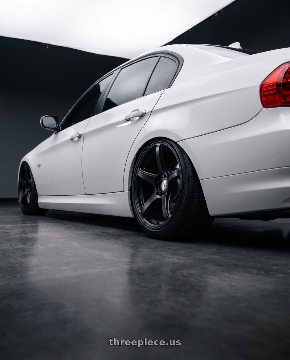 2011 bmw 328i xdrive with Work Emotion T5R wheels rear three quarter view slight stretch tires