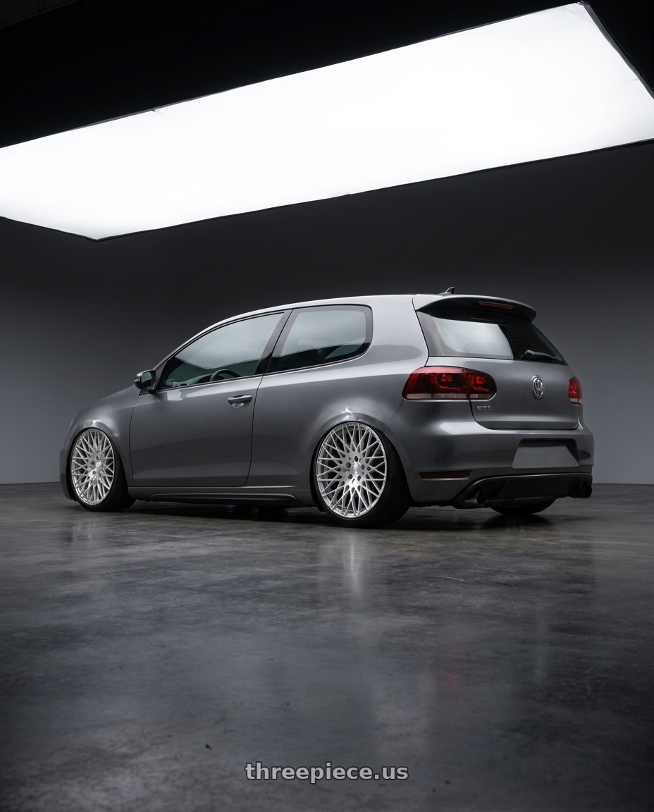 2013 Volkswagen GTI MK6 with Avant Garde Wheels M540 5X112 18x9 +48 Silver Machined wheels rear three quarter view slight stretch tires
