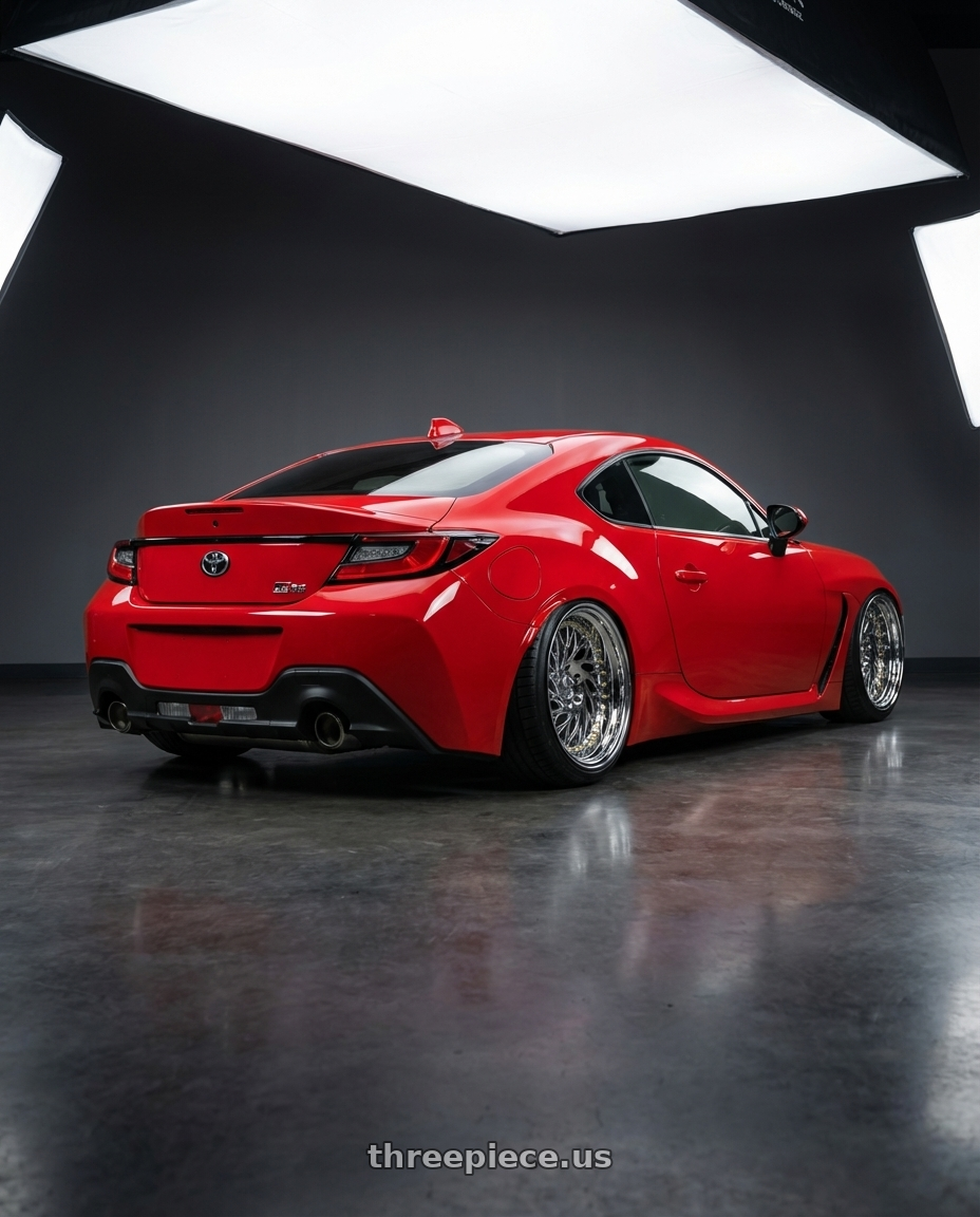 2024 Toyota GR86 with Aodhan DS03 5x114.3 18x9.5 +30 Vacuum Chrome w/Gold Rivets wheels rear three quarter view slight stretch tires