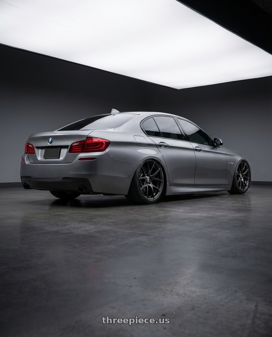 2016 BMW 5 Series F10 with Forgestar CF5V 5x120 20x12 +52 Satin Black wheels rear three quarter view slight stretch tires