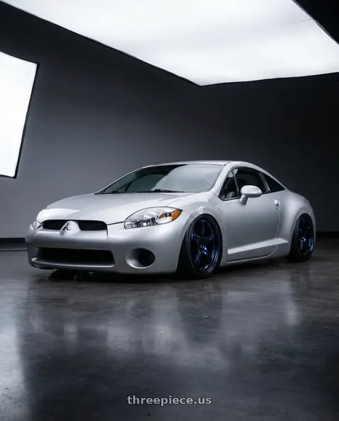 2010 Mitsubishi Eclipse with Gram Lights 57CR 5x114.3 18x9.5+12 Eternal Blue Pearl wheels