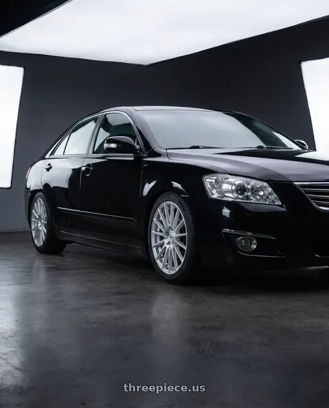 2008 Toyota Camry with V�xx Capo 5x112/5x120 18x8+45 Silver Mach Face wheels