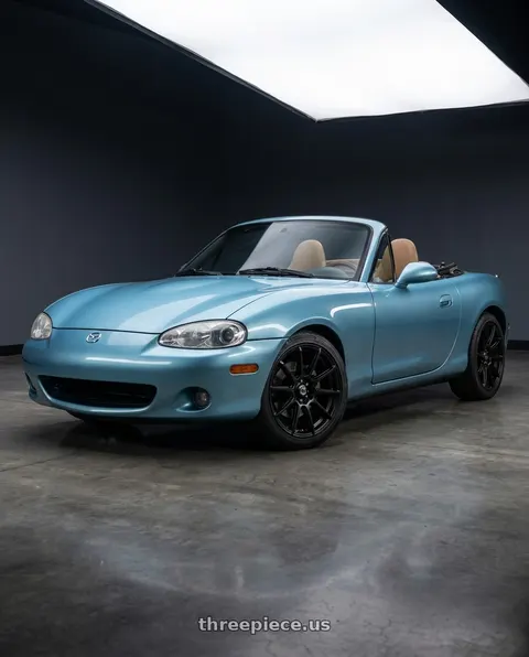 2002 Mazda Miata with Konig 45B Control 4x100 / 4x108 14x6 +40 Black wheels