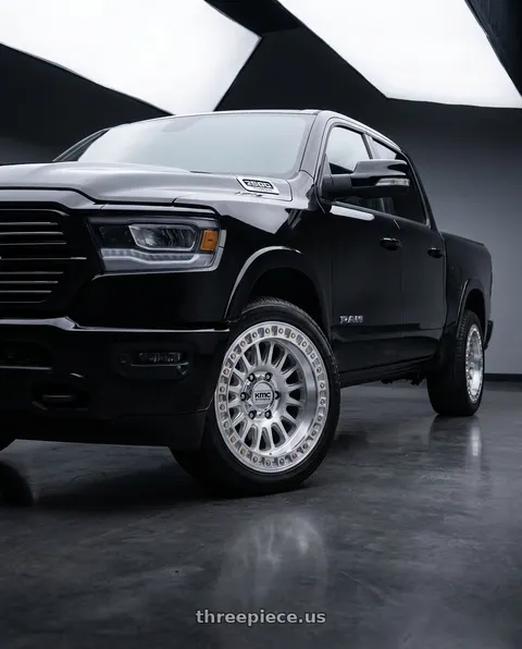 2019 Ram 1500 Laramie with KMC KM552 IMS 6X139.7 18x9 +0 GLOSS SILVER W/ MACHINED FACE wheels