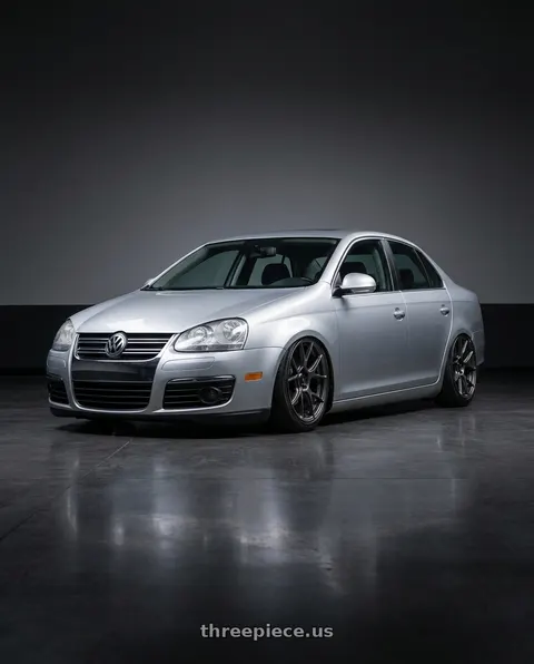 2009 Volkswagen Jetta with Konig Ampliform 5x112 18x8.5+43 Dark Metallic Graphite wheels