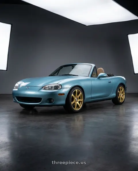 2002 Mazda Miata with RTX Ink 4x100 15x6.5 +40 Gold Machined wheels