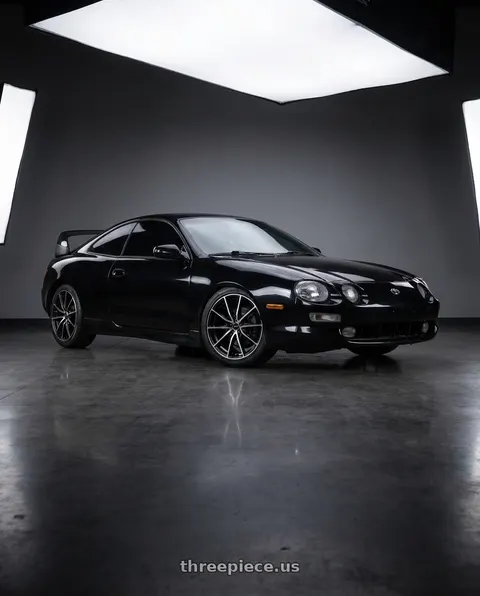 1999 Toyota Celica with Enkei DRACO 5x100 17x7.5+45 Black Machined wheels