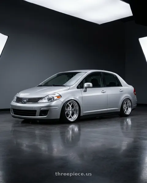 2007 Nissan tiida with Klutch SL2 4x100 15x8.5  +17 Silver Machined wheels