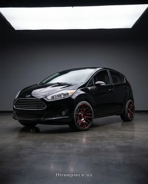 2016 Ford Fiesta with American Truxx Evolution AT1919 8x170 22x12-44 Black/Prizm/Red wheels