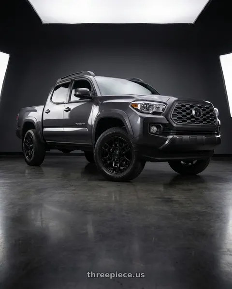 2021 Toyota Tacoma with OE Wheels TY17 6x139.7 16x7+13 Satin Black wheels