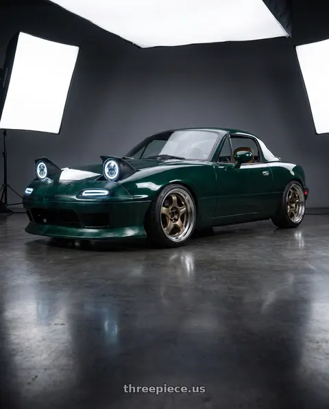 1991 Mazda Miata with Work Meister S1 2P 4x100 15x7+38 A Disk Titanium Gold wheels