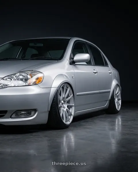 2005 Toyota Corolla with Maxxim 10S Winner 5X100/5x114.3 16x7 +40 Full Silver wheels