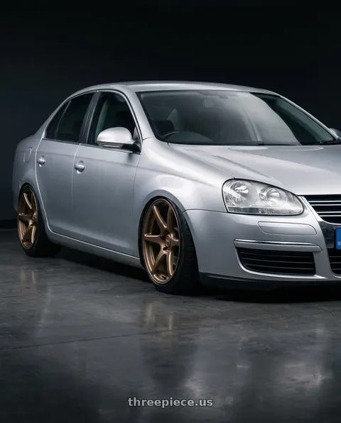 2009 Volkswagen Jetta with Kansei K11B Tandem 5X112 18x8.5 35 Bronze wheels