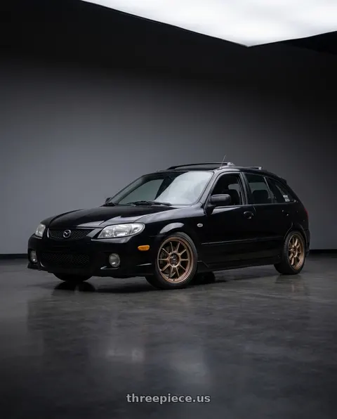 2002 Mazda Protege5 with Konig Hypergram 5x114.3 16x7.5+38 Race Bronze wheels