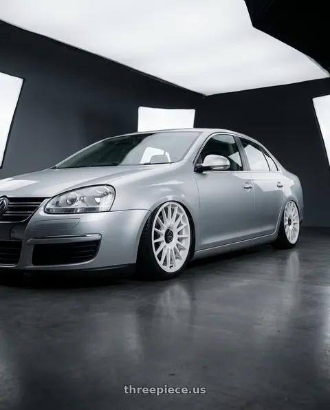 2009 Volkswagen Jetta with fifteen52 PODIUM 5x112 / 5x120 18x8.5 +35 RALLY WHITE (GLOSS WHITE) wheels