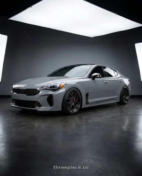 2023 Kia Stinger GT2 with Aodhan DS01 5x114.3 18x8.5+35 Black Vacuum W/ Gold Rivets wheels