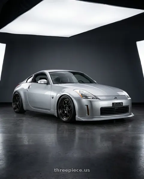 2003 Nissan 350Z with Aodhan DS01 5x114.3 18x8.5+35 Black Vacuum W/ Gold Rivets wheels