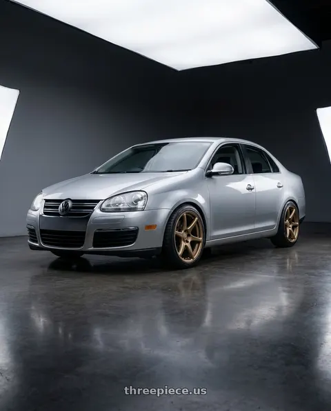 2009 Volkswagen Jetta with Kansei K11B Tandem 5X112 18x8.5 35 Bronze wheels