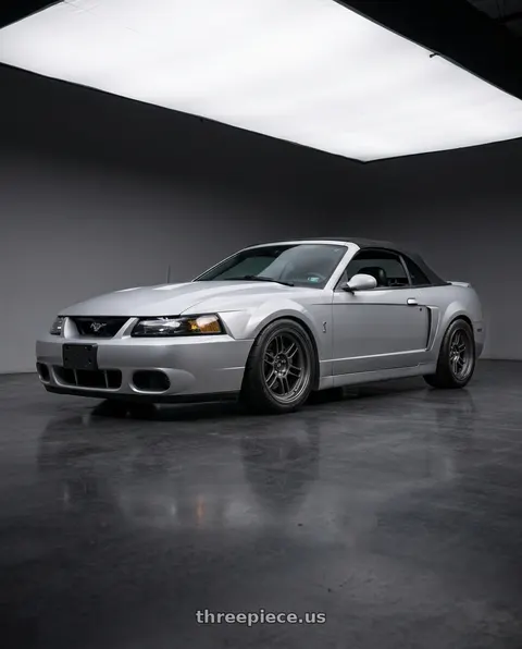2004 Ford Mustang with MST Wheels Suzuka 5X114.3 18x9.5 +25 Matte Gunmetal wheels