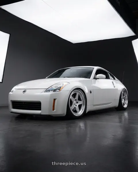 2005 Nissan 350Z Enthusiast with Kansei K12H KNP 5x114.3 18x8.5 35 Hyper Silver wheels