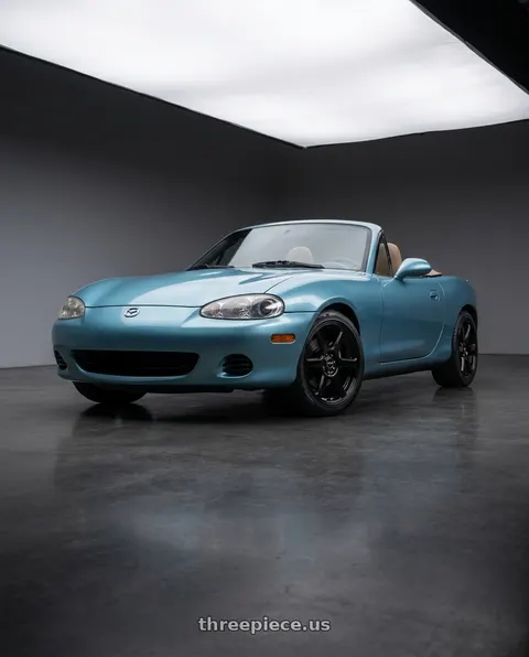 2002 Mazda Miata with Raceline 146B Matrix 4X100/4x114.3 15x7 40 Gloss Black wheels